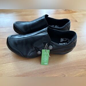 Taos Footwear Black Leather Slip-Ons with Button Detail